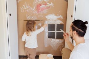photo-of-child-painting-cardboard-3933253