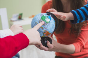 children-touching-globe