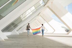 lgbt-couple-holding-rainbow-flag-1