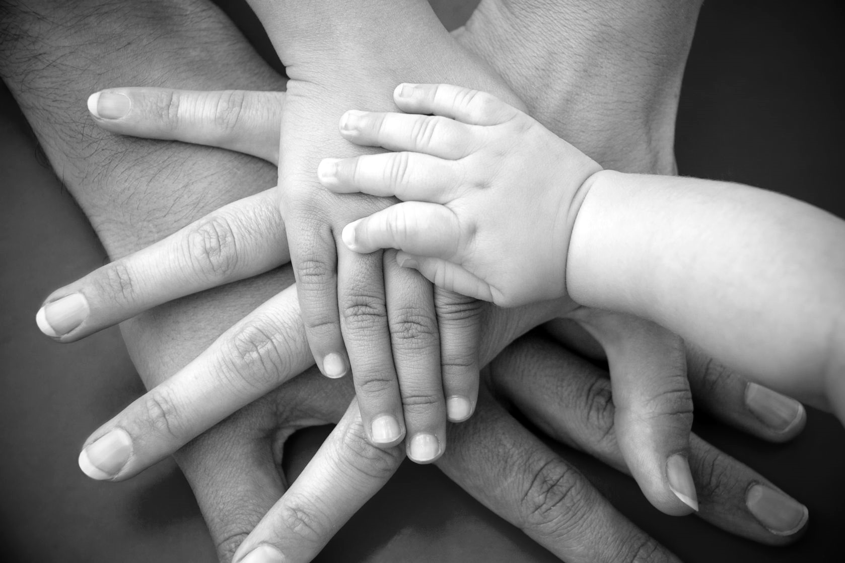 intergenerational-hands-black-and-white
