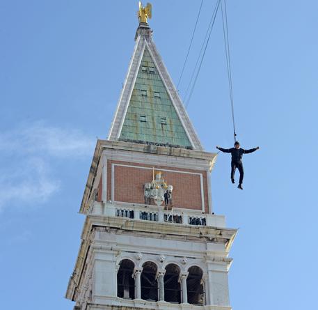 Renzo Rosso, Italian owner of Fashion brand 'Diesel', goes down from the Bell Tower Campanile in St Mark's Square during the traditional 'Volo dell'Aquila' (Flight of the Eagle) during the Venice Carnival in Venice, Italy, 11 February 2018. The carnival season in the historical lagoon city attracts revellers from around the world every year. ANSA/ANDREA MEROLA