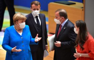 German Chancellor Angela Merkel gestures next to France's President Emmanuel Macron, Sweden's Prime Minister Stefan Lofven and Finland's Prime Minister Sanna Marin during the first face-to-face EU summit since the coronavirus disease (COVID-19) outbreak, in Brussels, Belgium July 18, 2020. John Thys/Pool via REUTERS