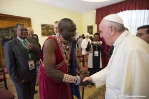 Pope Francis (R) is greeted during a meeting with inter-religious and ecumenical representatives at the apostolic nunciature in Nairobi, Kenya, November 26, 2015. REUTERS/Osservatore Romano/Handout via Reuters ATTENTION EDITORS - THIS IMAGE WAS PROVIDED BY A THIRD PARTY. REUTERS IS UNABLE TO INDEPENDENTLY VERIFY THE AUTHENTICITY, CONTENT, LOCATION OR DATE OF THIS IMAGE. IT IS DISTRIBUTED EXACTLY AS RECEIVED BY REUTERS, AS A SERVICE TO CLIENTS. FOR EDITORIAL USE ONLY. NOT FOR SALE FOR MARKETING OR ADVERTISING CAMPAIGNS. NO RESALES. NO ARCHIVE.