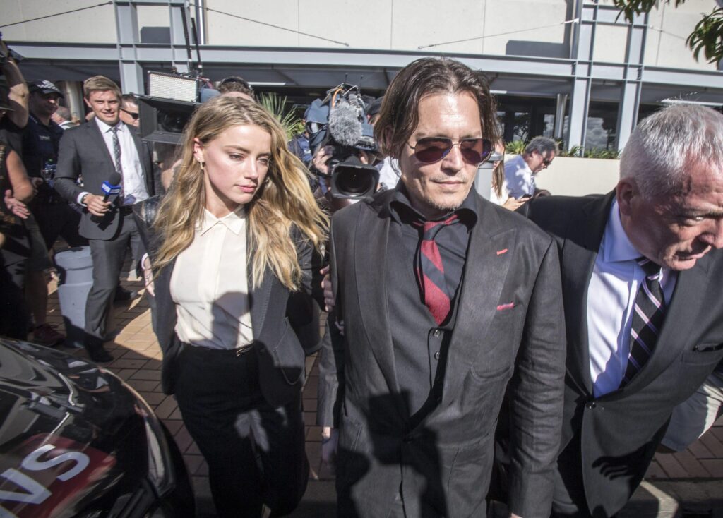epa05264973 US actor Johnny Depp (R) and his wife US actress Amber Heard (L) leave the Southport Magistrates Court in Southport, on the Gold Coast, Australia, 18 April 2016. Heard, 29, pleaded guilty before an Australian court for producing false quarantine documents for her two dogs when entering the country last year. Heard, accused of illegally importation of the animals, admitted the charges at the beginning of the trial at the Southport Magistrates Court in Queensland in Eastern Australia where she arrived on 18 April with Depp, surrounded by a large crowd of reporters and fans. EPA/GLENN HUNT AUSTRALIA AND NEW ZEALAND OUT EDITORIAL USE ONLY