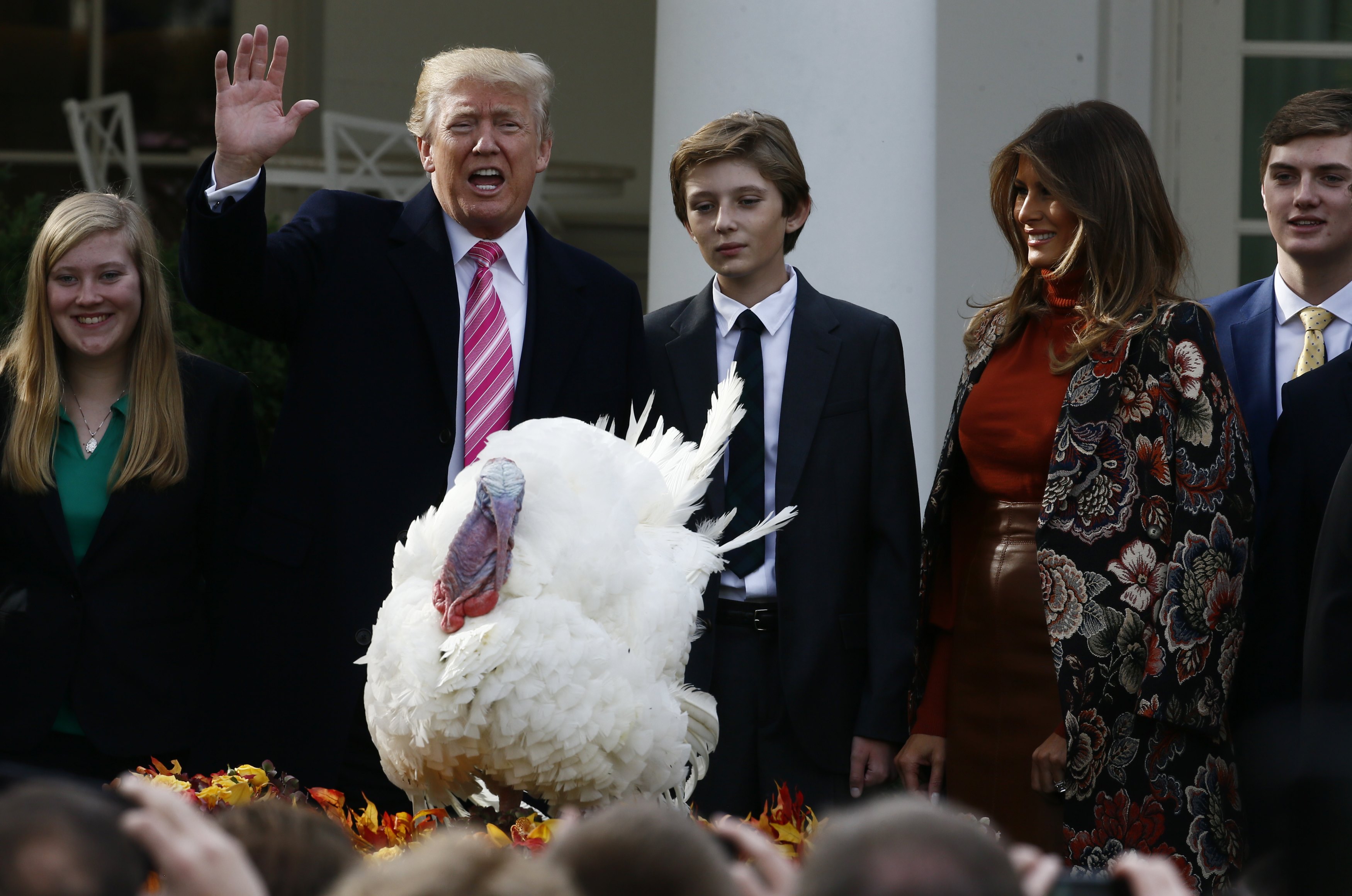U.S. President Donald Trump participates in the 70th National Thanksgiving turkey pardoning ceremony as son Barron and first lady Melania Trump look on in the Rose Garden of the White House in Washington, U.S., November 21, 2017. REUTERS/Jim Bourg