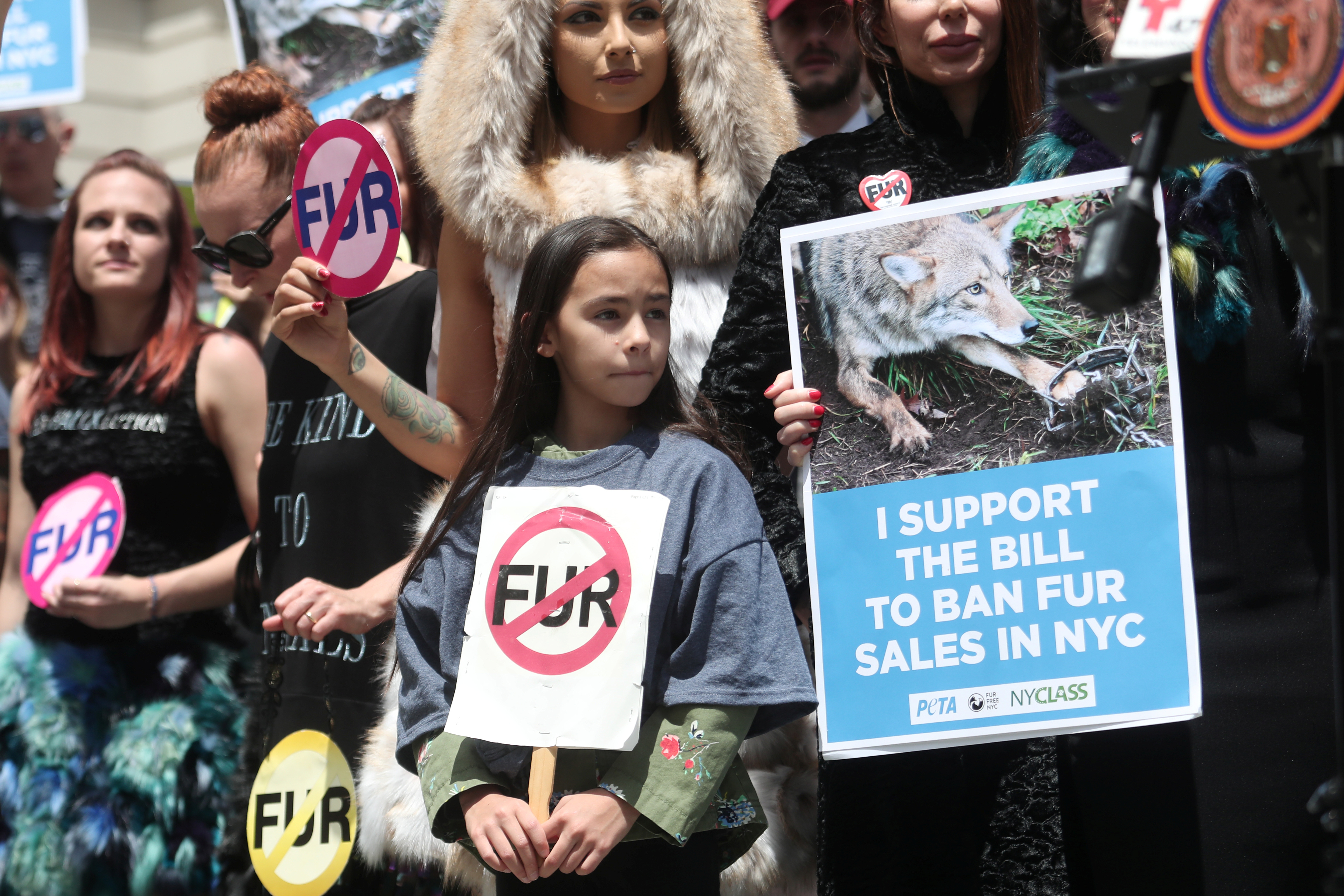 Supporters of a ban on fur sales stand on the steps of City Hall in New York, U.S., May 15, 2019. REUTERS/Shannon Stapleton