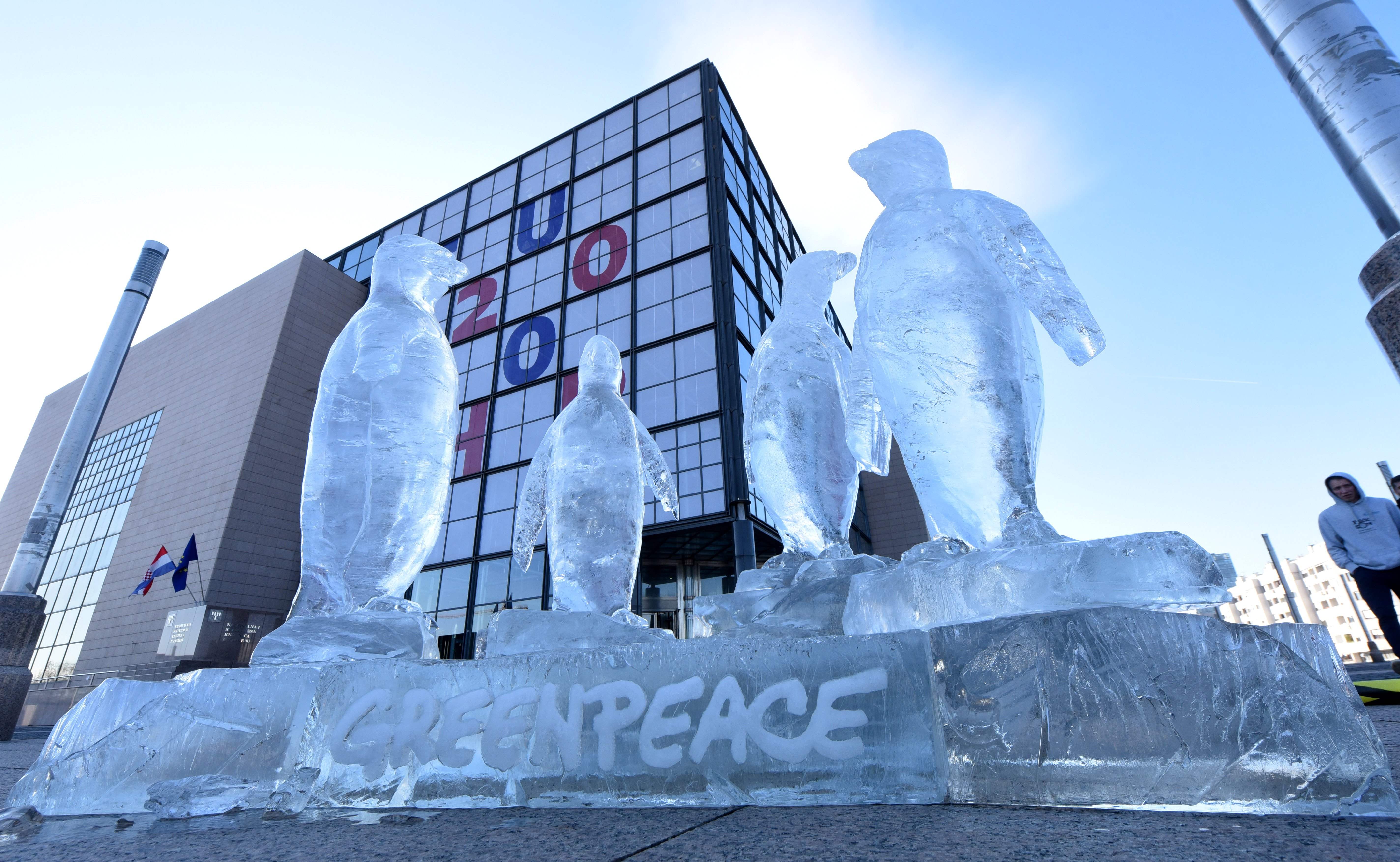 An ice sculpture depicting penguins has been installed by Greepeance activists outside the national and university library, the seat of Croatia's EU rotating presidency, as part of an international campaign to protect oceans, in Zagreb, on February 7, 2020. (Photo by Denis LOVROVIC / AFP)