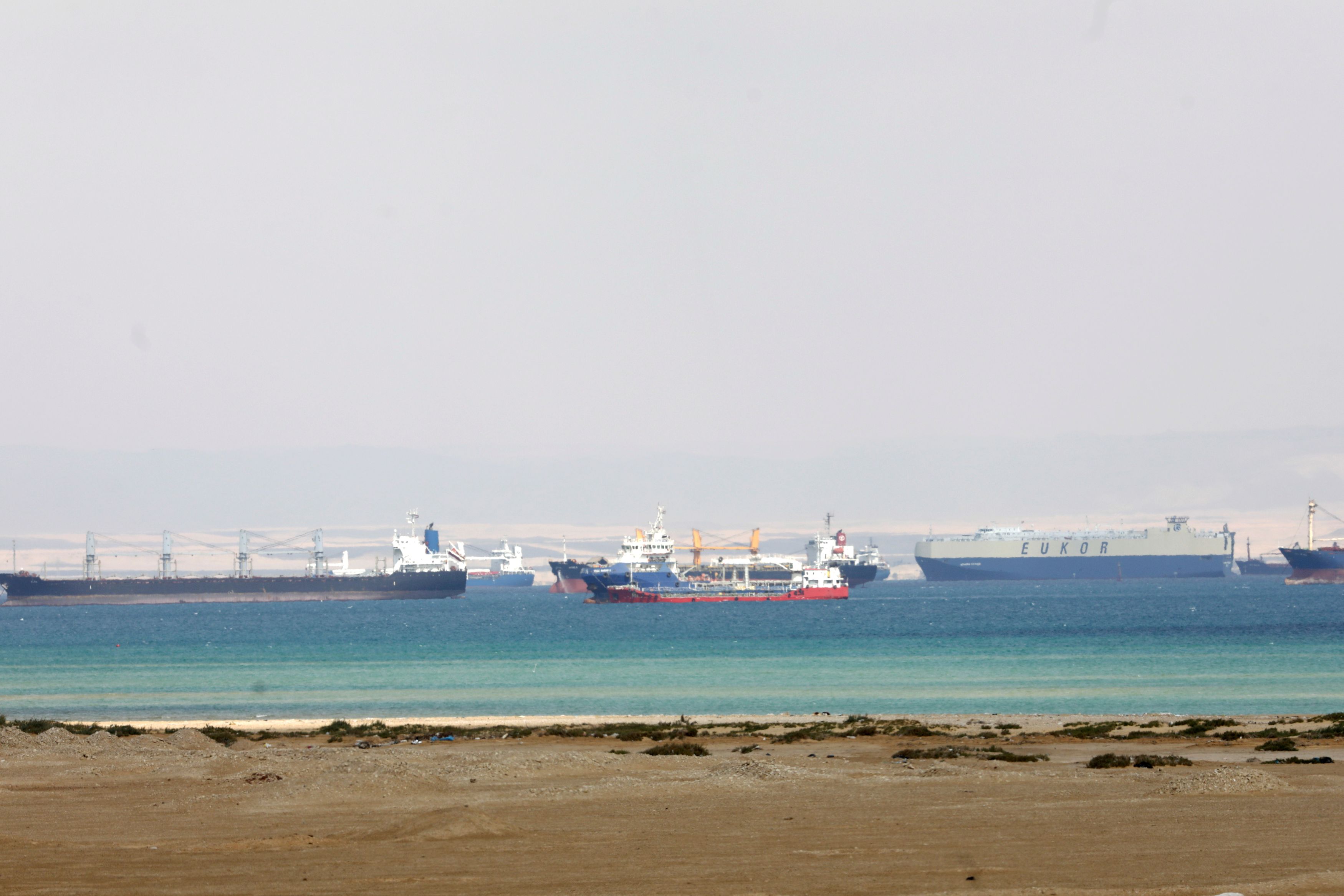 FILE PHOTO: Ships are seen at the entrance of the Suez Canal, Egypt March 26, 2021. REUTERS/Mohamed Abd El Ghany/File Photo
