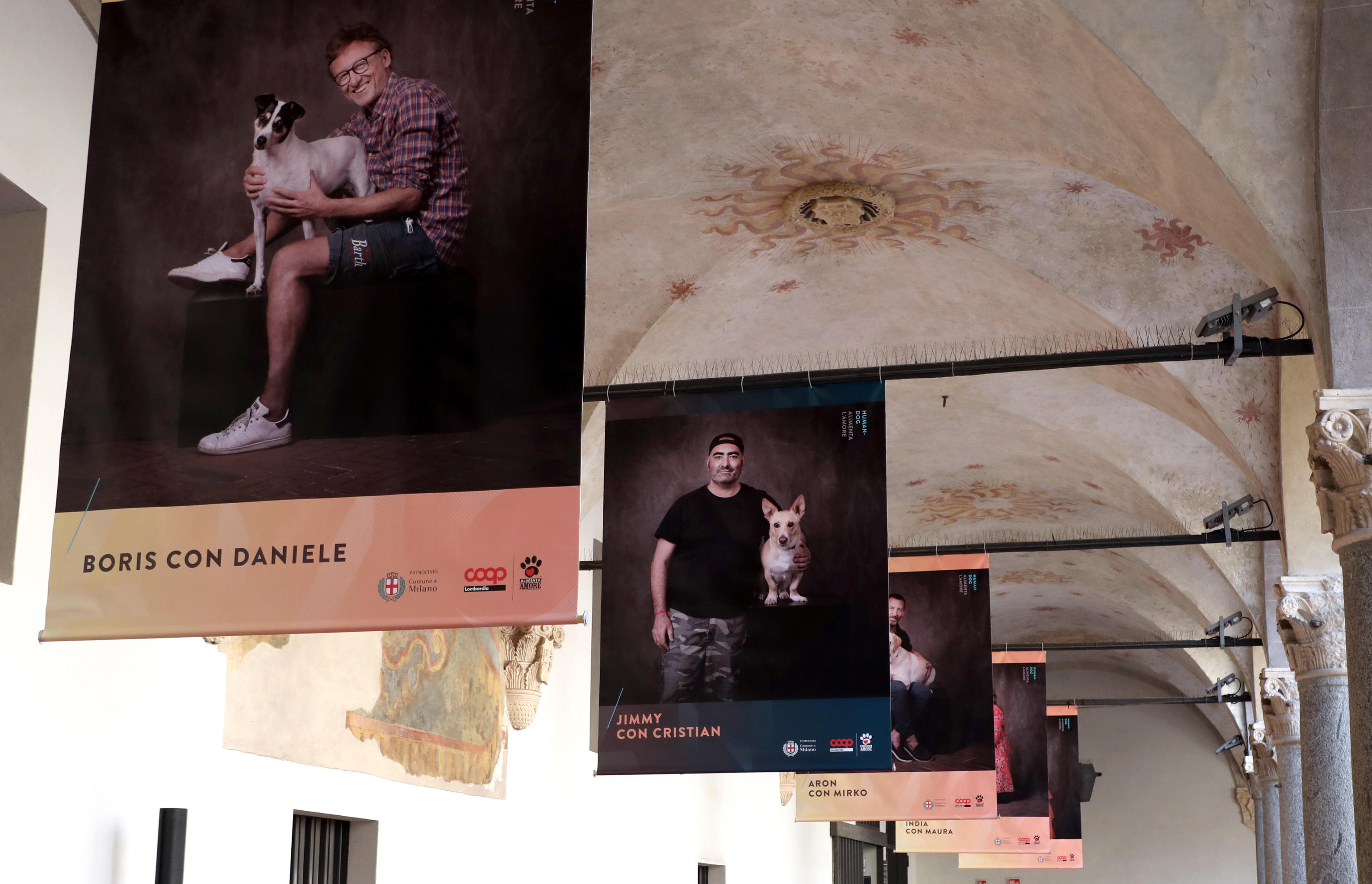 Alcune delle foto realizzate da Silvia Amodio ed esposte al castello Sforzesco di Milano in occasione della mostra Human dog, alimenta lamore. Milano 2 Ottobre 2021. ANSA / MATTEO BAZZI